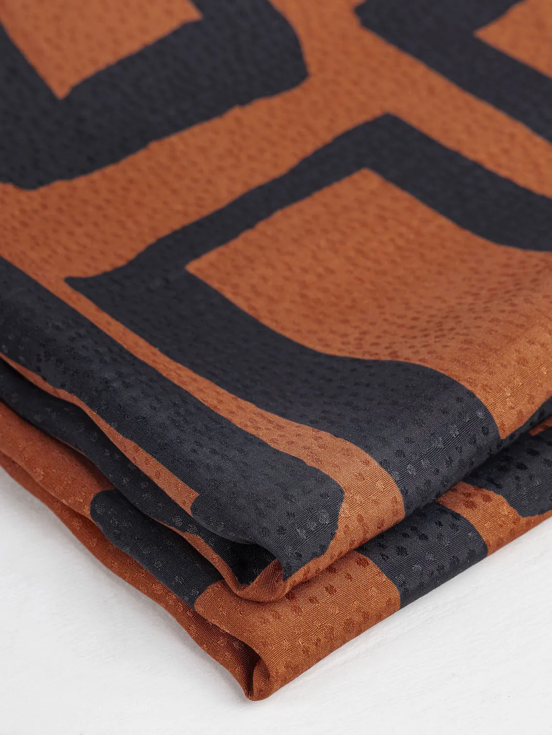 Geo Square Print Viscose Dobby - Pumpkin   Charcoal